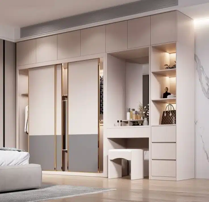 Modern built-in wardrobe with sliding doors and integrated dressing table — smart storage solution for spacious bedrooms in Delhi homes